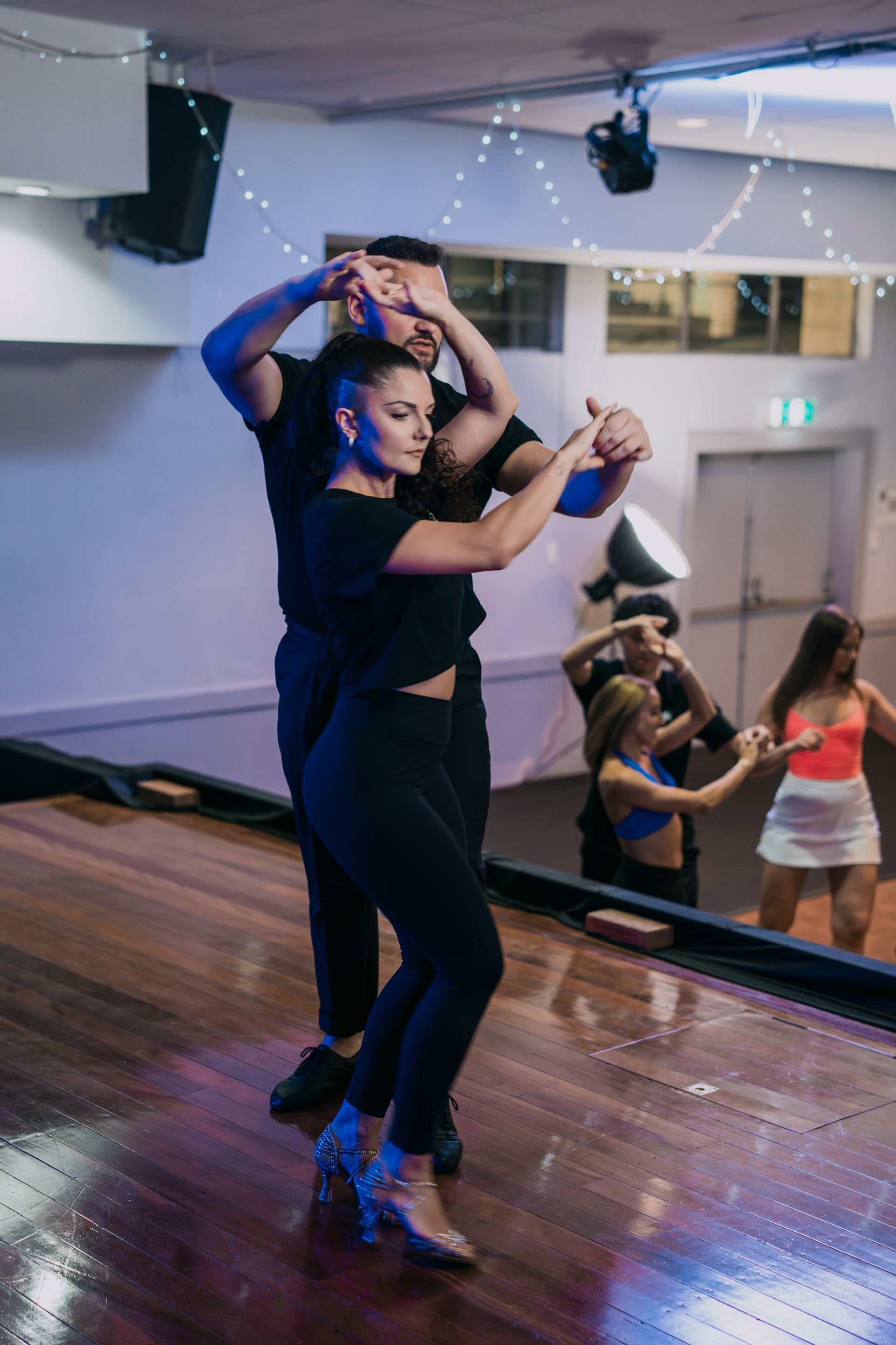 Madalyn and Alex doing a turn pattern on stage