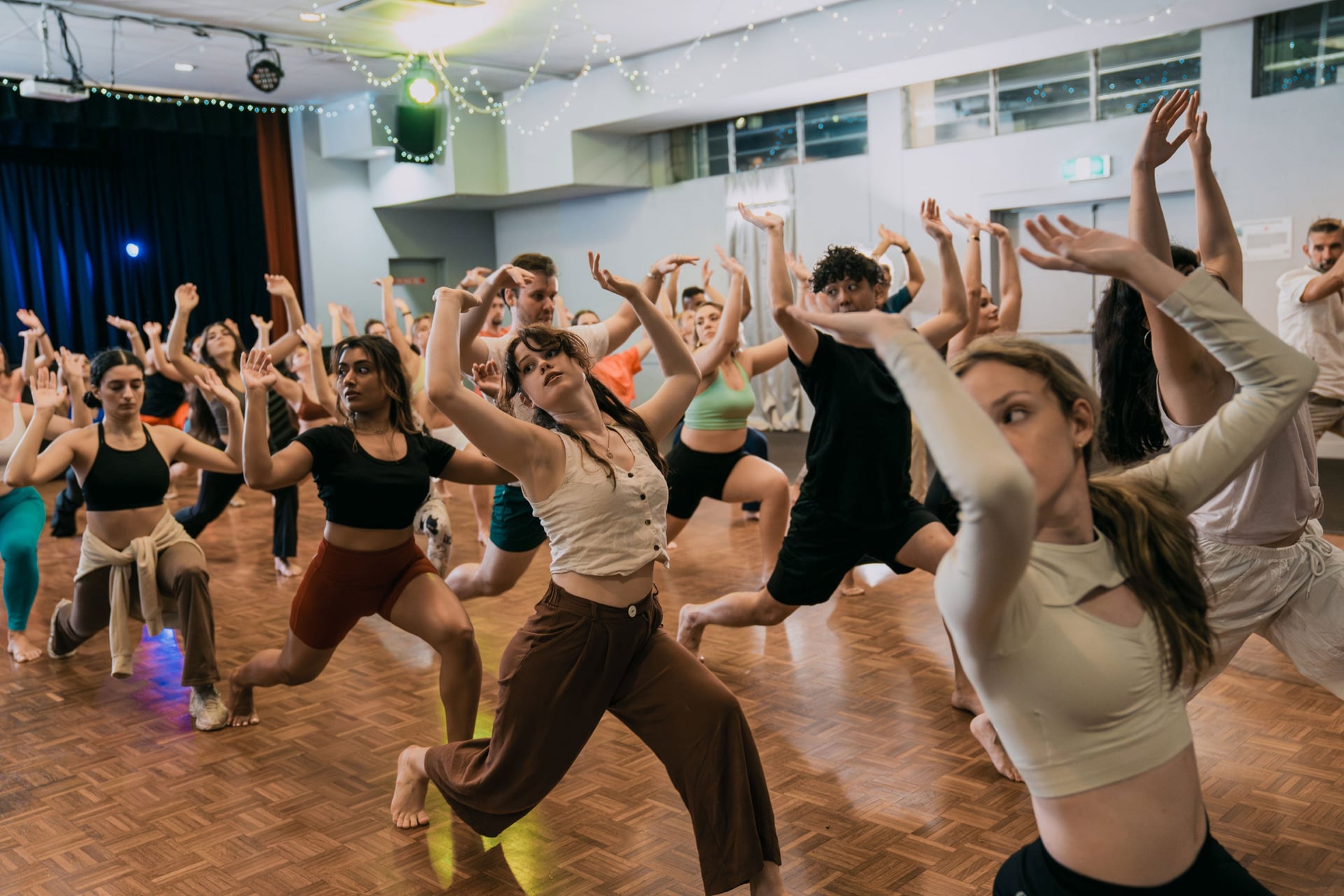 Body movement class with everyone doing arm movement